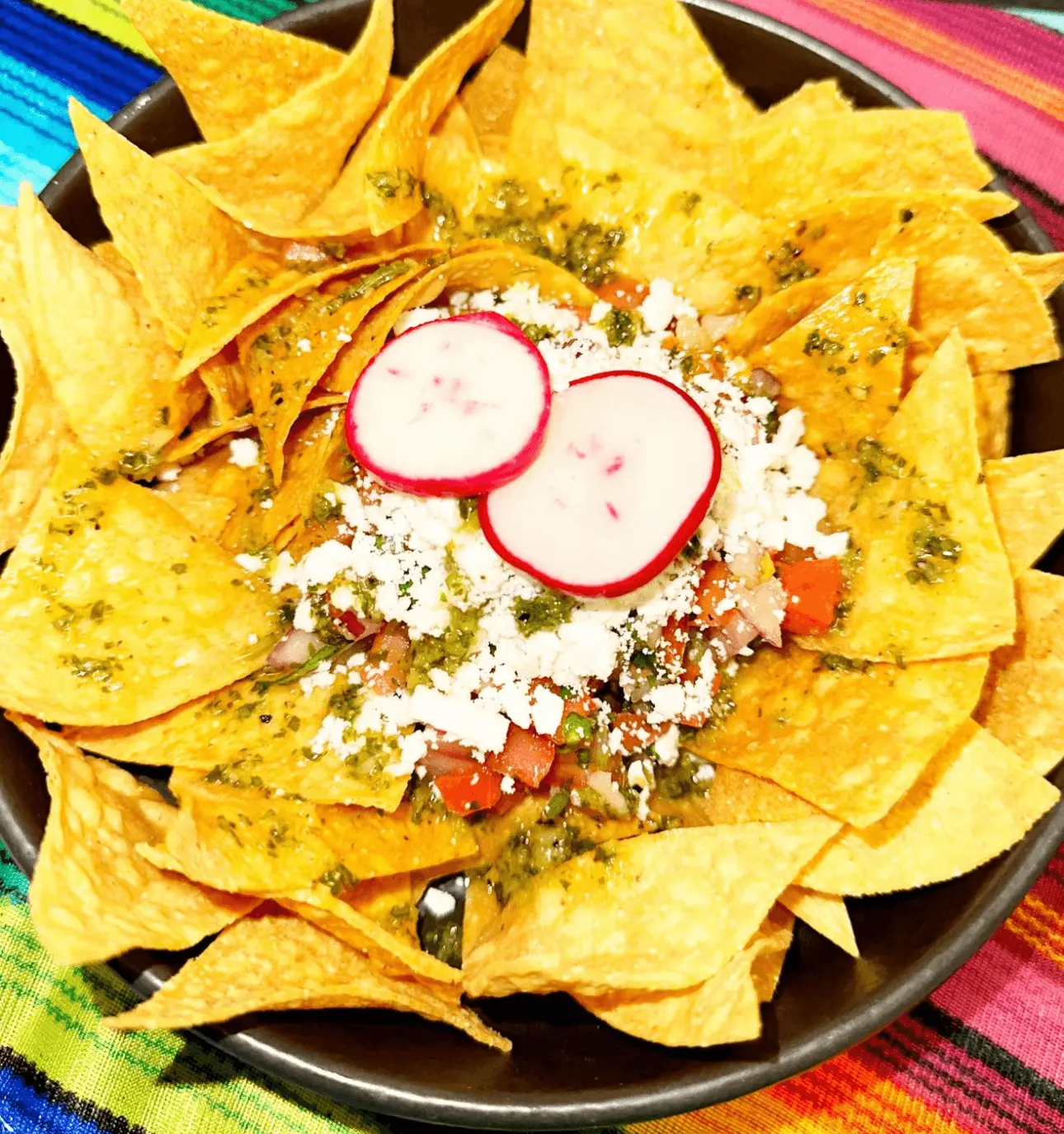 Homemade tortilla chips with guacamole and pico de gallo at PiKanté Edmonton